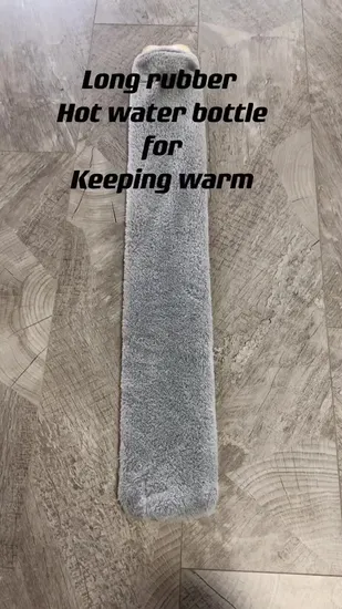 Long Rubber Hot Water Bottle Bag with Colorful Plush Cover and POM Poms 